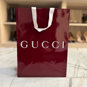 Gucci Burgundy paper Shopping Bag. 10x14x5.5”